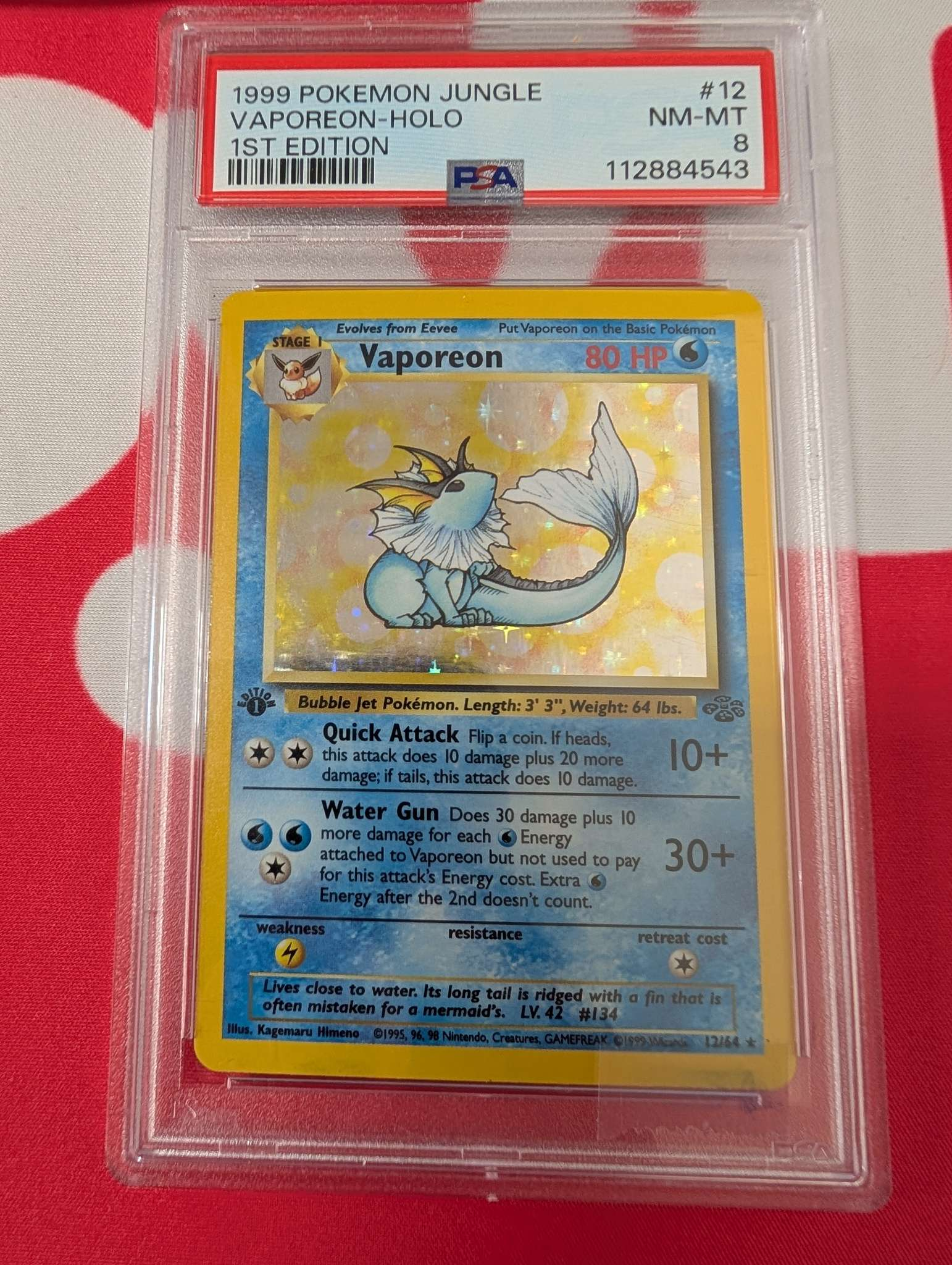 Graded Vaporeon 12/64 1st Ed PSA 8
